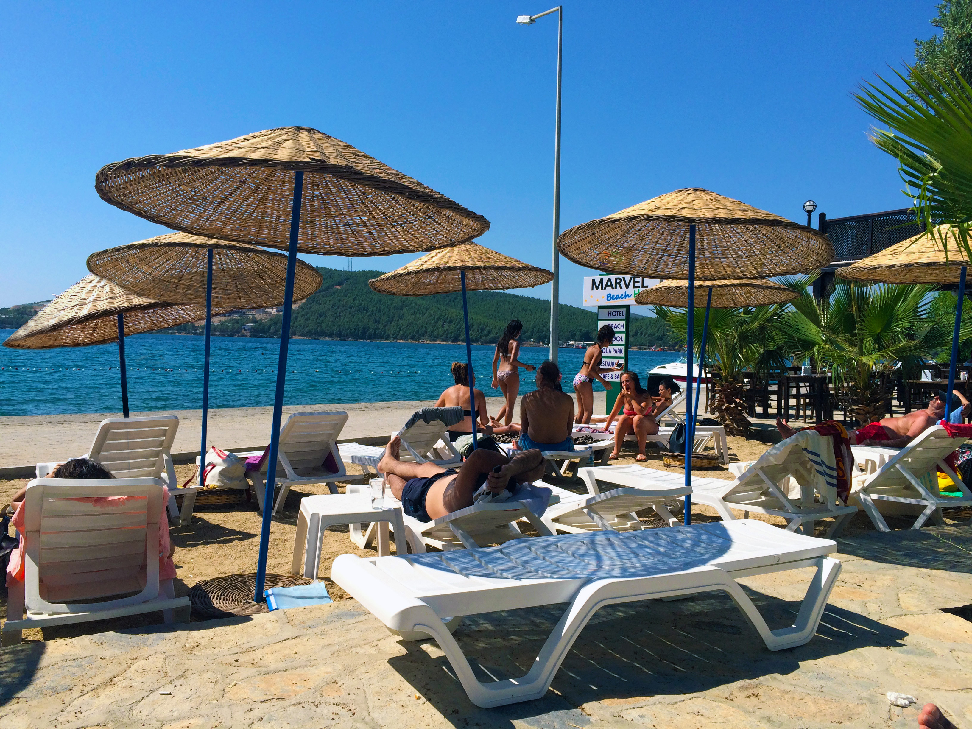 Beach-with-MBH-sign-on-the-back-MBH